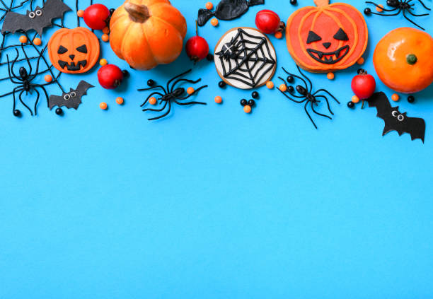 istock Halloween background with cookies, spiders and bats, top view 1344860650