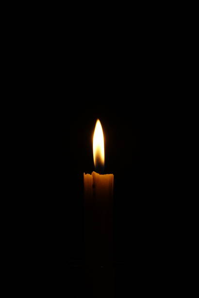 istock The light of candle in the dark room 1344861421
