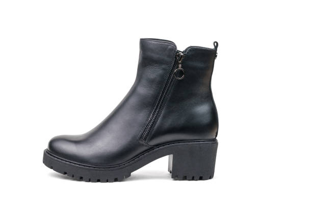 istock A small women's leather boot isolated on a white background. 1344862331