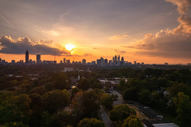 istock sunset over Piedmont Park with Atlanta skyline 1344864042