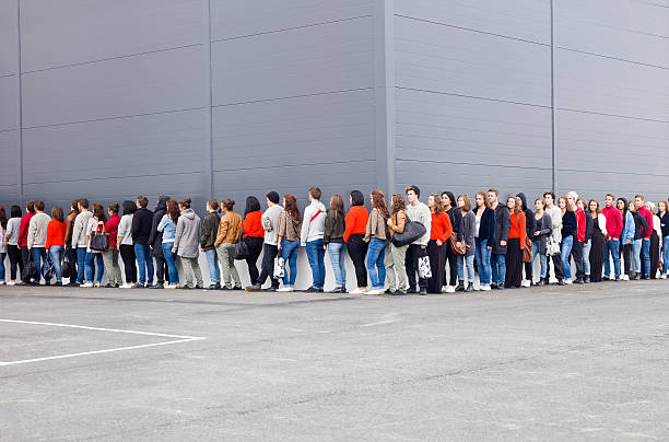 Waiting in Line Large group of people waiting in line waiting in line stock pictures, royalty-free photos & images