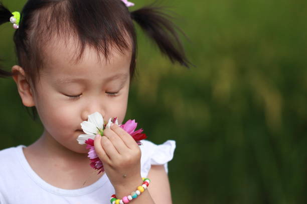 istock smiling Asian girl playing in paddy. 1344865606