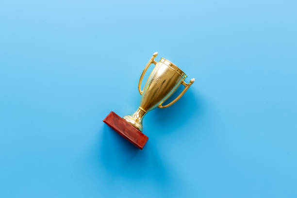 istock Champion award - golden trophy cup for winner, top view 1344866407