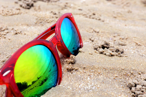 istock Sunglasses on sandy beach in summer 1344867200