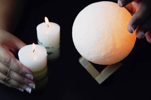 istock Moon lamp with candle on a dark backgroundon. Divination concept. 1344869949