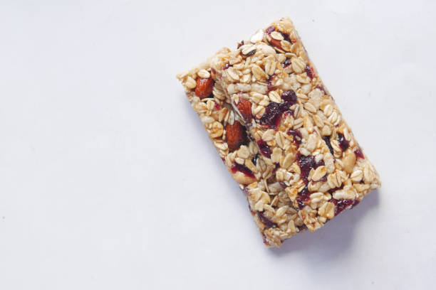 istock Almond , Raisin and oat protein bars on white background . 1344871882