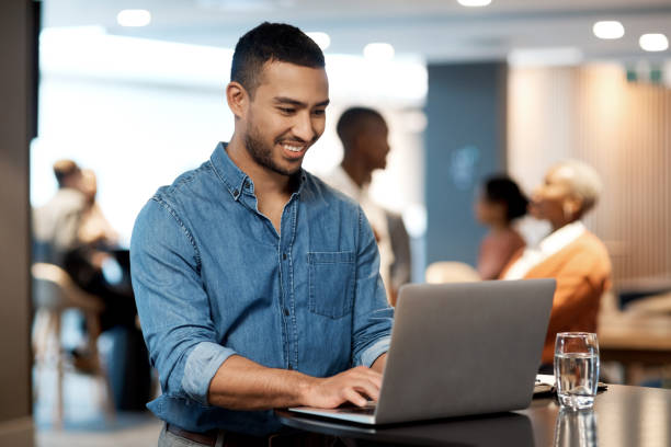 istock Shot of a young businessman using a laptop at a conference 1344874382