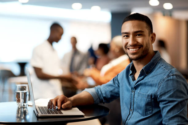 istock Shot of a young businessman using a laptop at a conference 1344874383