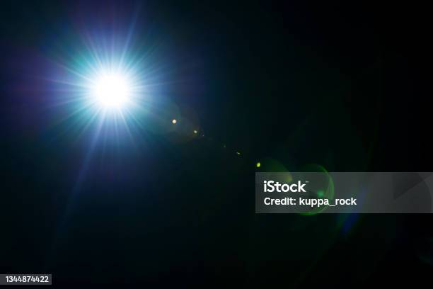 Graphic Material Lens Flare Dazzling Light Stock Photo - Download Image Now - Lens Flare, Back Lit, Black Background