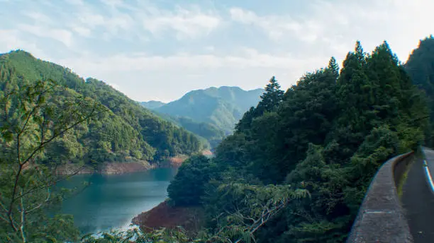 Mountains reflected on the green lake in Fujino, Kanagawa, Japan.