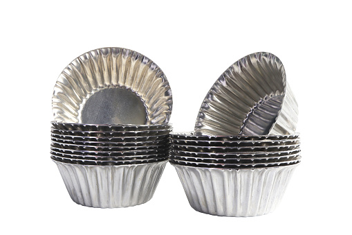 Aluminium cup cakes molds on white background, clipping path included.