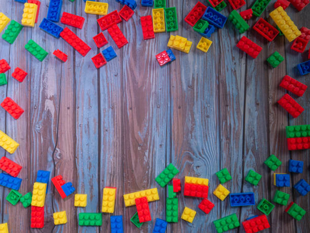 istock brick toys multi  on wood  for background or education concept 1344876579