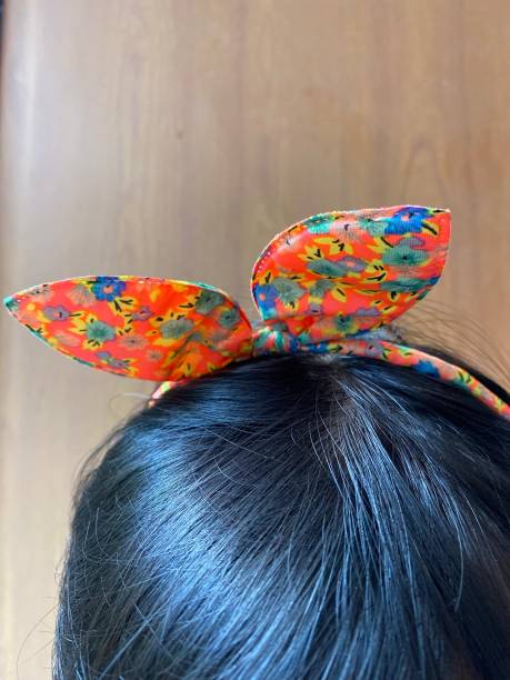 istock orange headband on a child's head 1344883384