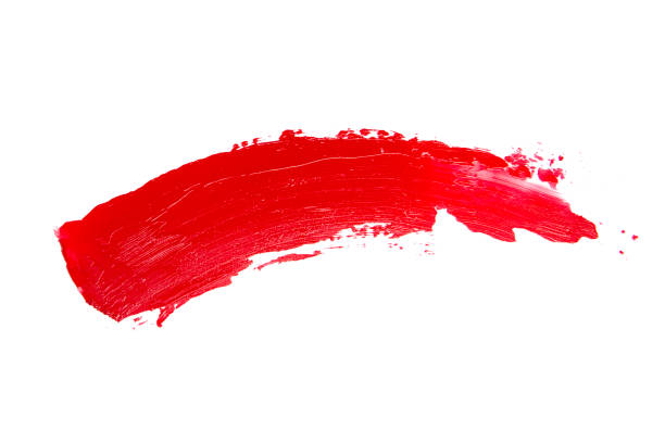istock Red creamy texture lipstick track isolated on the white background 1344884747