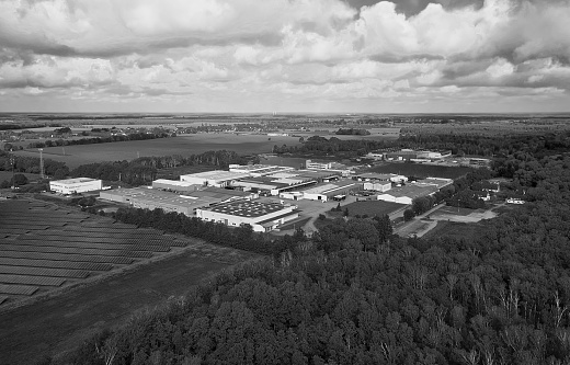 Aerial view of a commercial area with warehouses and production halls in Germany, black and white