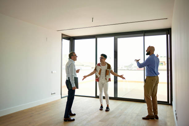 istock Prospective Buyers Gesturing as They Talk With Real Estate Agent 1344886188