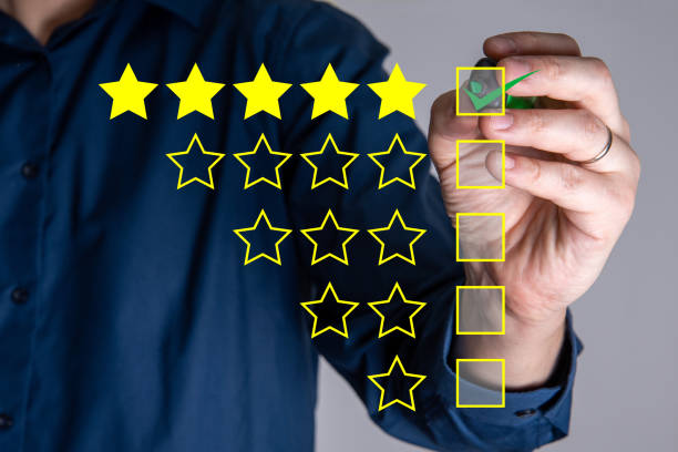 istock The hand writes a 5-star checkmark as the best choice. 1344889094