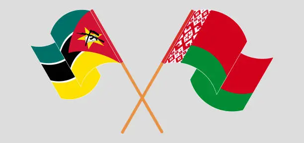 Vector illustration of Crossed and waving flags of Mozambique and Belarus
