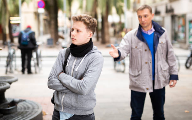 istock Upset teenage boy scolded by father 1344891693