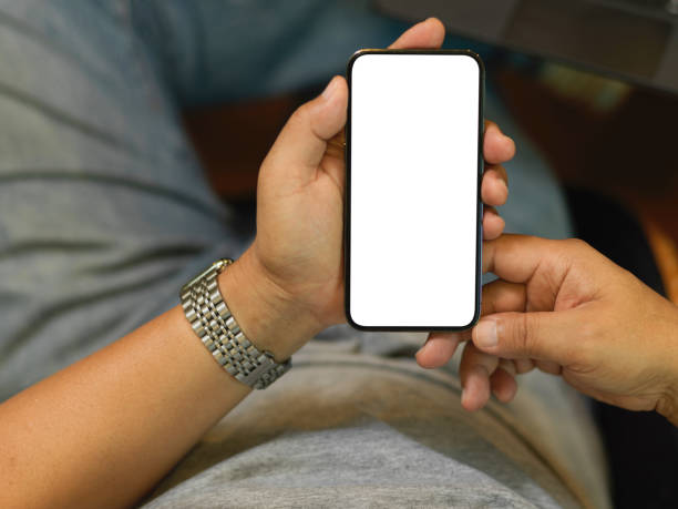 istock Cropped shot of Aged business man using smartphone, blank screen mockup 1344894613