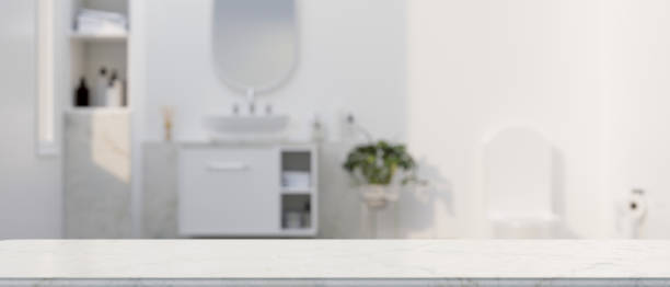 istock Marble white counter top for montage over elegance white bathroom interior in the background 1344894715