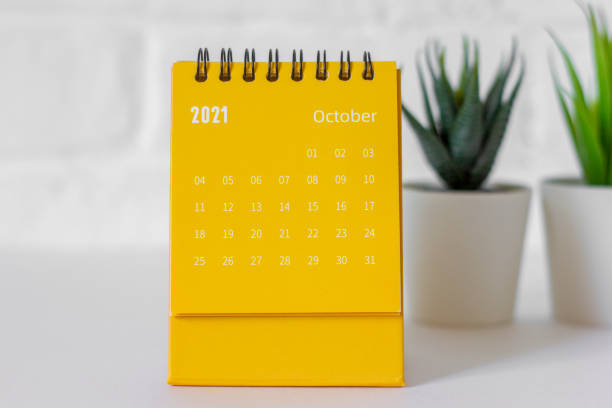 istock Calendar with tear-off sheets for October 2021.Hello October.Close-up. 1344895210