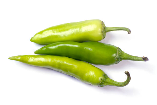 istock Several multi-colored hot chili peppers isolated on white background 1344896095