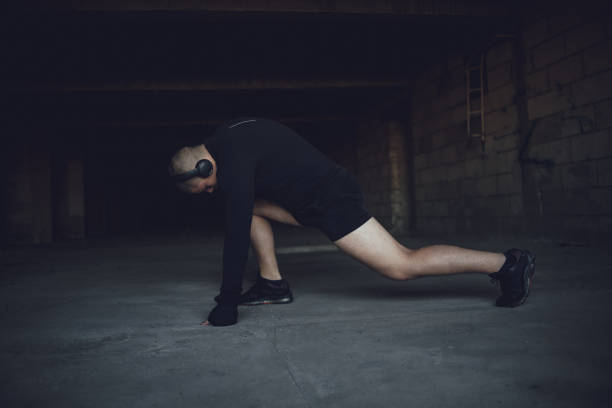 istock A kickboxing man trains alone in an abandoned building 1344896309
