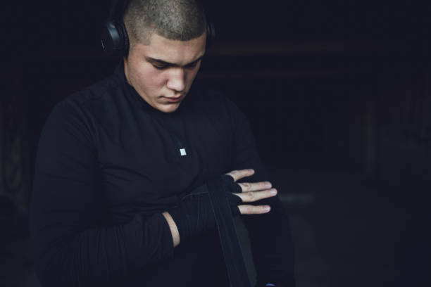 istock A kickboxing man trains alone in an abandoned building 1344896310