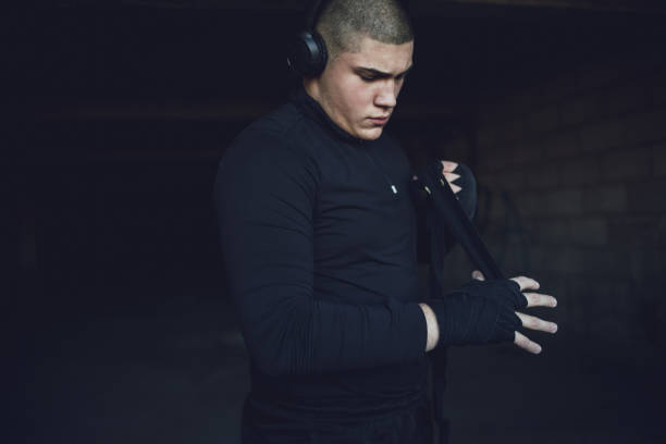 istock A kickboxing man trains alone in an abandoned building 1344896321
