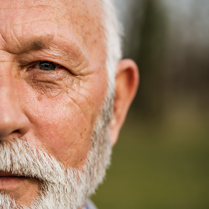 Close up portrait of senior man. Part of senior man face.