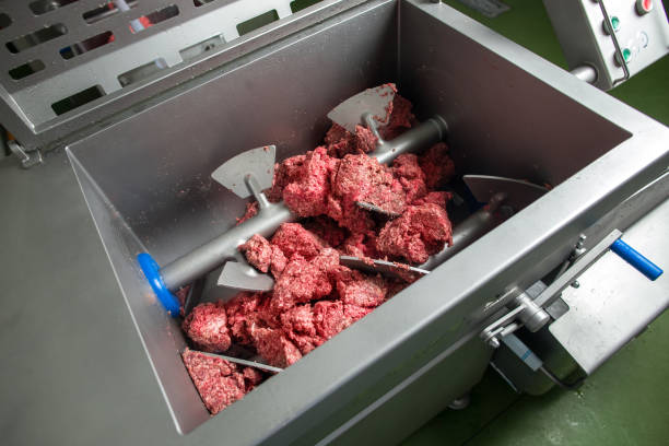 sausage making process, mincer mince meat - meat grinder ground beef meat imagens e fotografias de stock