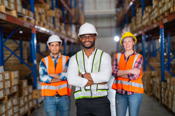 istock A small group of warehouse workers standing in a large distribution center 1344897648