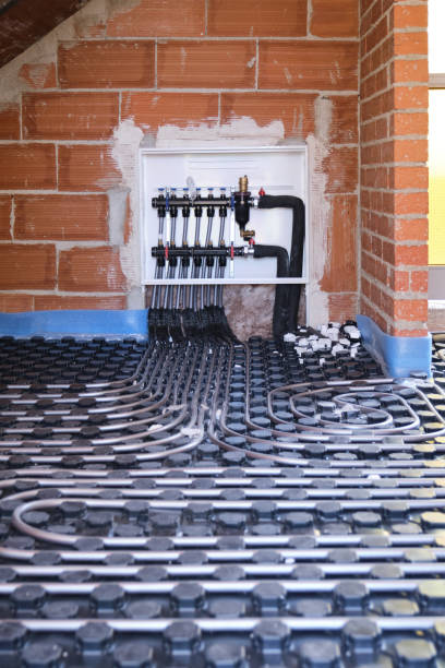 istock Radiant floor heating hydronic manifold with flexible tubing. 1344898734