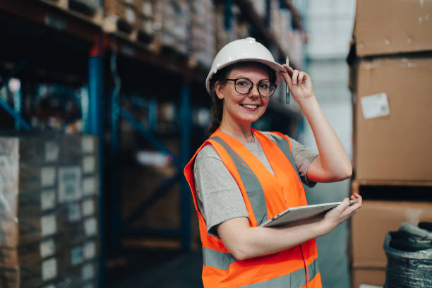 Portrait of a warehouse worker standing in a distribution center stock photo