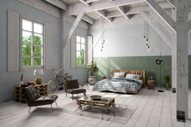 istock Loft Attic Bedroom With Messy Bed, Leather Armchairs, Coffee Table And Bicycle. 1344898898