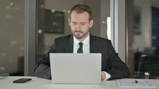 istock Businessman working on Laptop at Night 1344901119