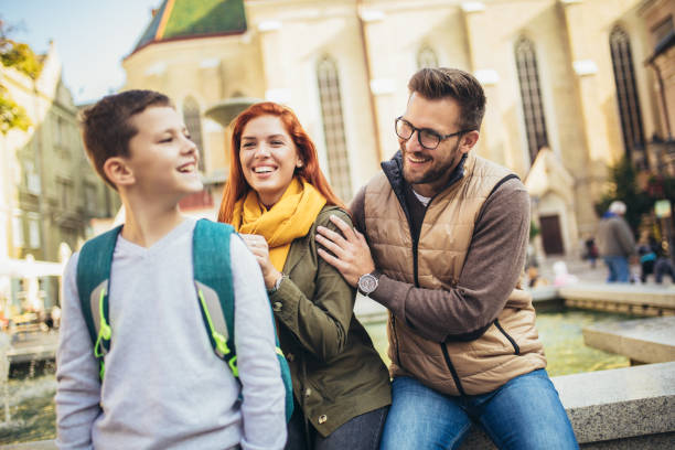 istock Young parents taking their little child to school 1344901653
