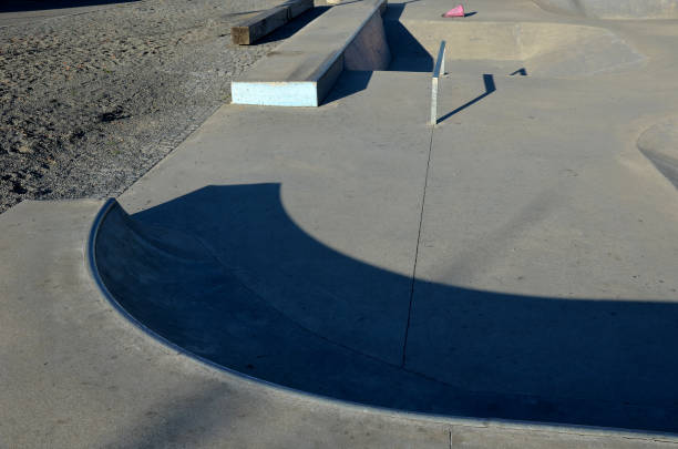 istock Skateboard park with concrete cement surface with concrete skateboard obstacles is designed for roller sports. Cycling is not allowed except for freestyle bikes. Protective clothing, head, elbow knee 1344902634