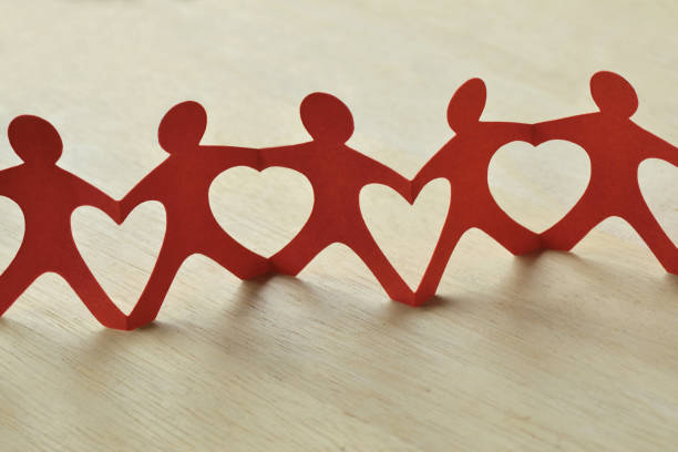 istock Paper people chain with hearts - Teamwork and love concept 1344903849