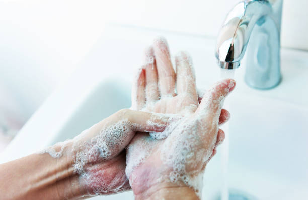 istock Washing hands with soap under running water 1344909125
