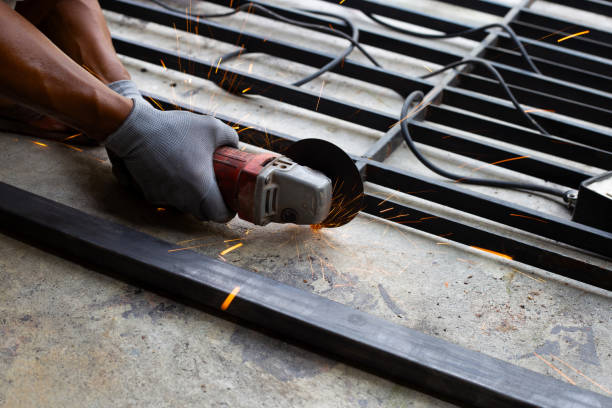 istock Close up, A man working with angle grinder. Iron gate repair 1344909366