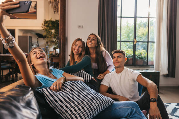 istock Friends taking a selfie on the couch 1344909654