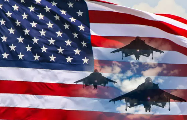 Photo of USA air forces strike concept. Fighter aircrafts on American flag background