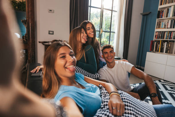 Friends taking a selfie on the couch