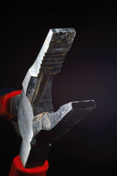 istock old used pliers on a black background. close-up. 1344910986