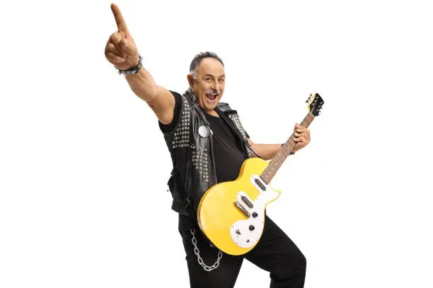 Mature man with an electric guitar raising hand isolated on white background
