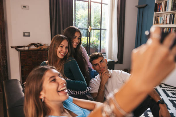 istock Friends taking a selfie on the couch 1344911947