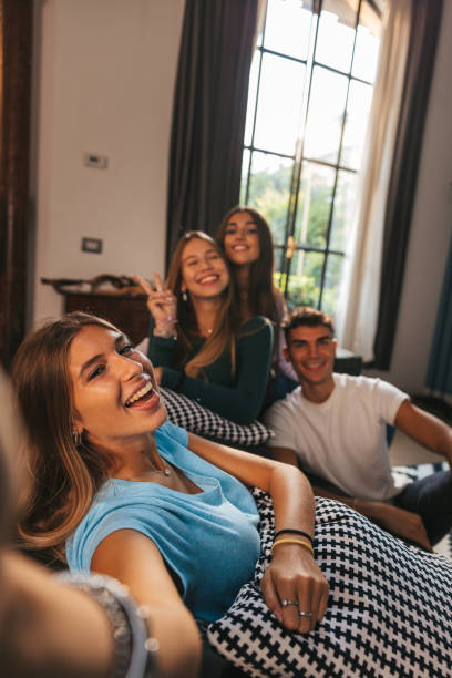 istock Friends taking a selfie on the couch 1344912837