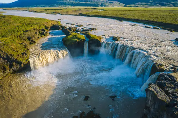 The aerial view of the beautiful waterfall of Godafoss after rainy days, Iceland in the summer season.